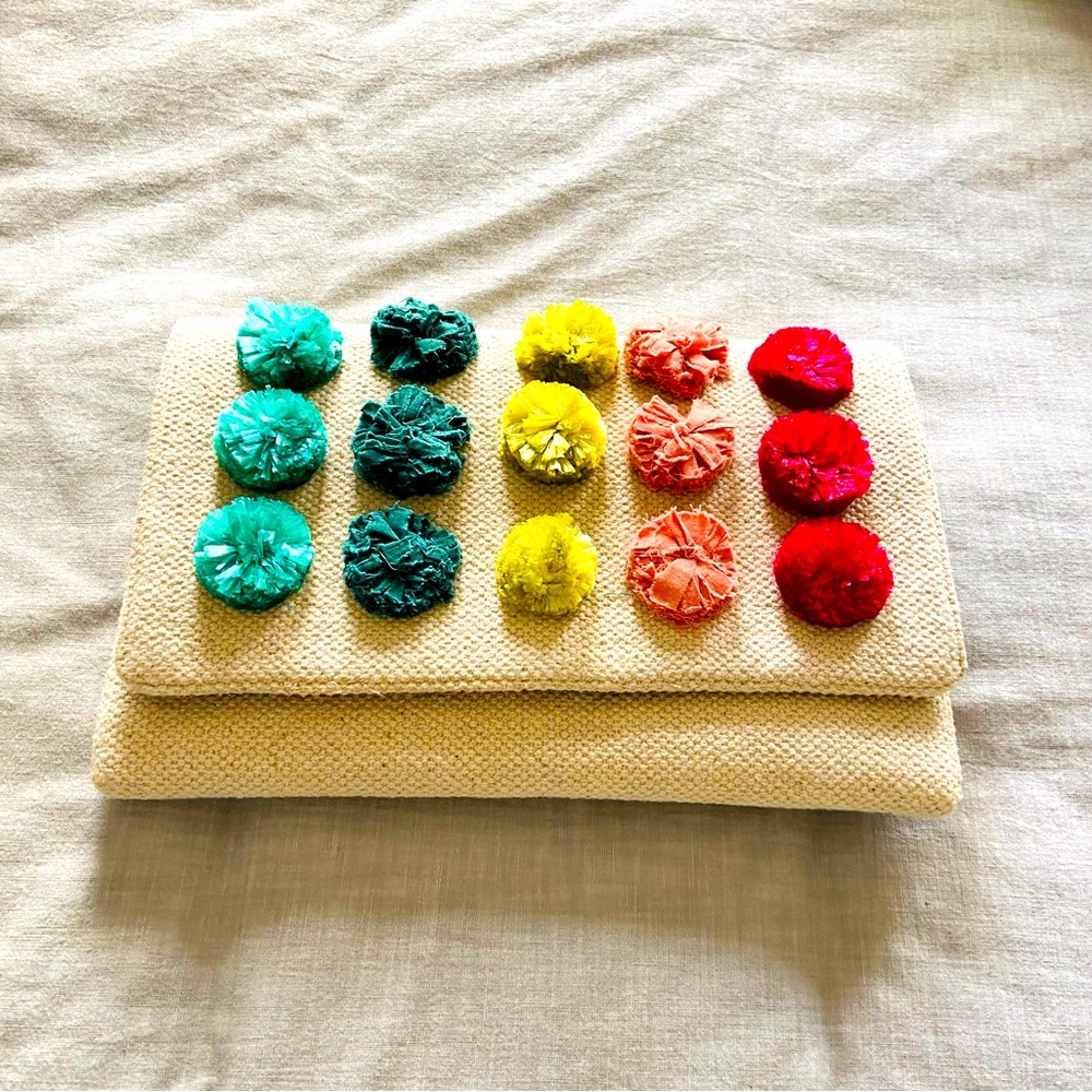 Stella & Dot cream clutch with colorful Pom-pom florets
